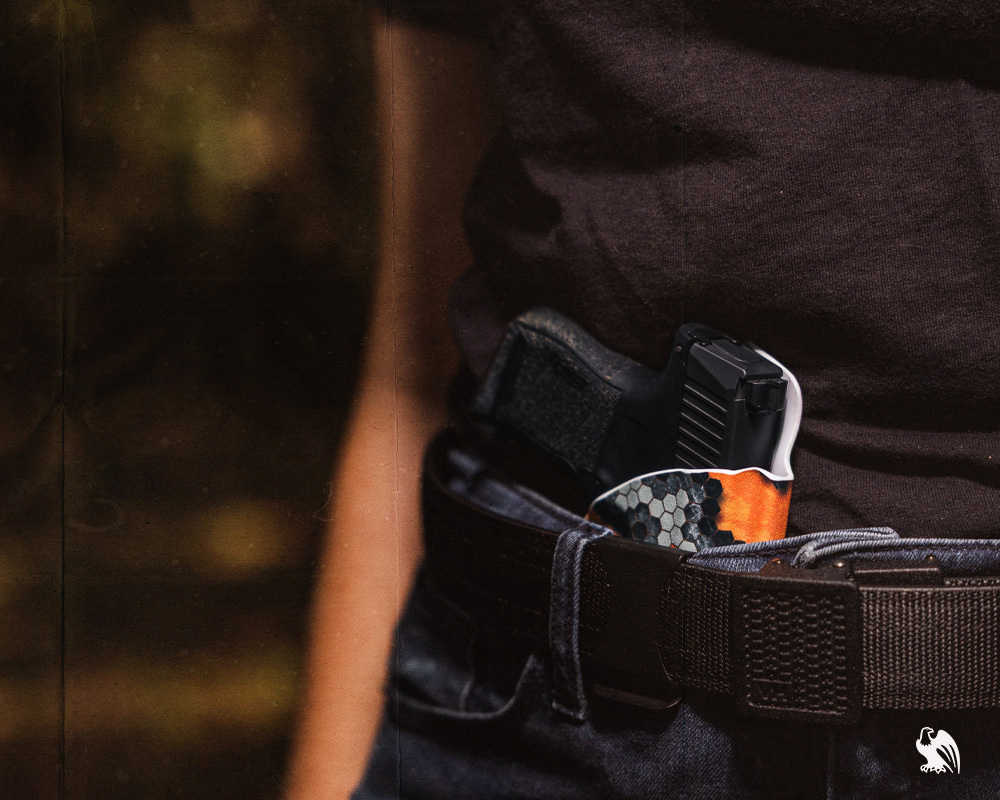 Woman carrying IWB with a Vedder Holsters