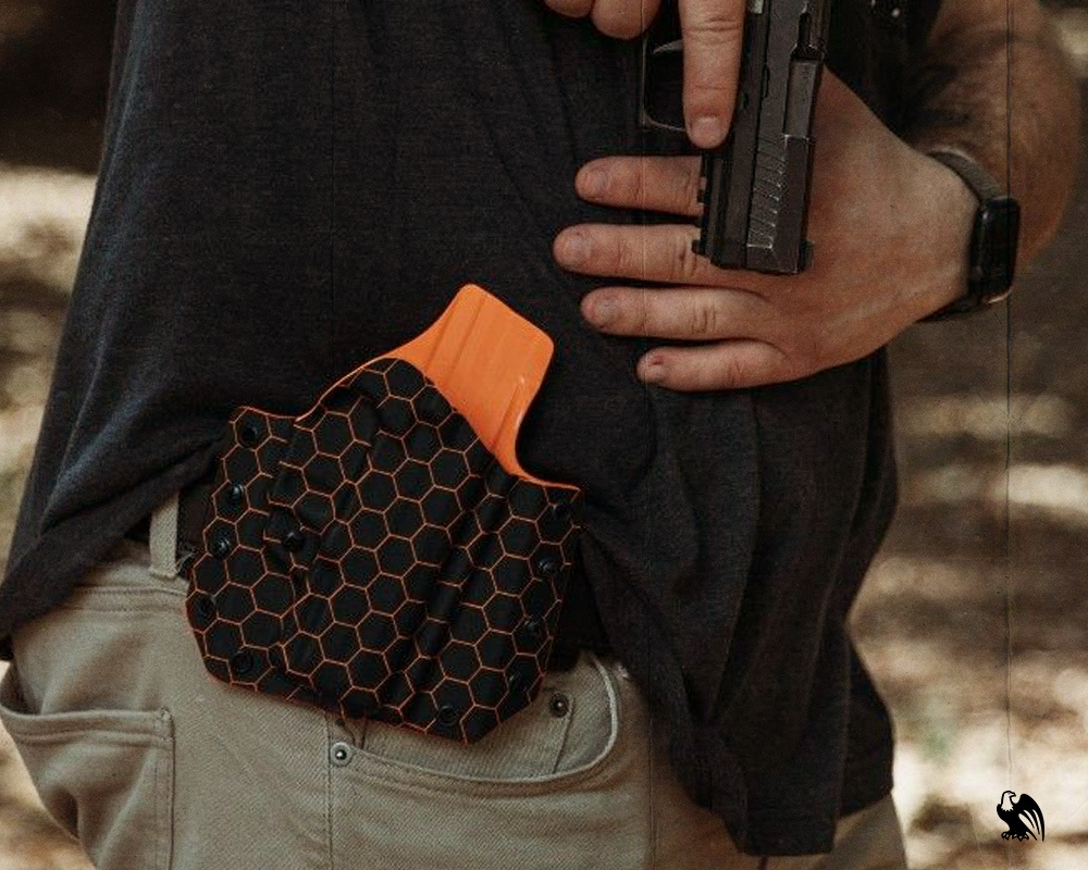 Man carrying OWB with a reliable Vedder Holsters.