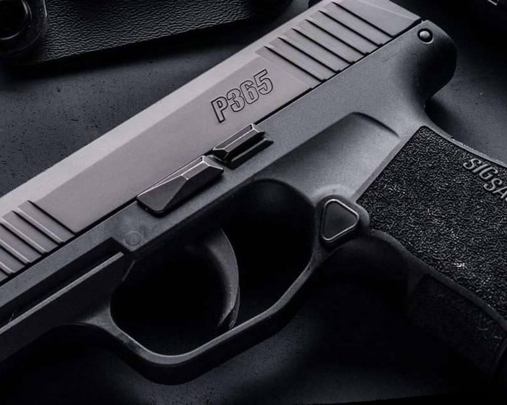 Close up image of the Sig Sauer P365. Close up of the trigger area of the handgun. 