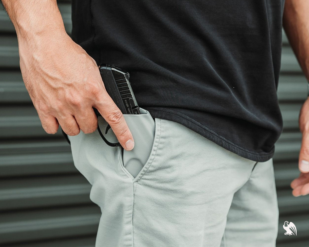 Man removing his handgun out of his Pocket Locker Holster from his pocket. 