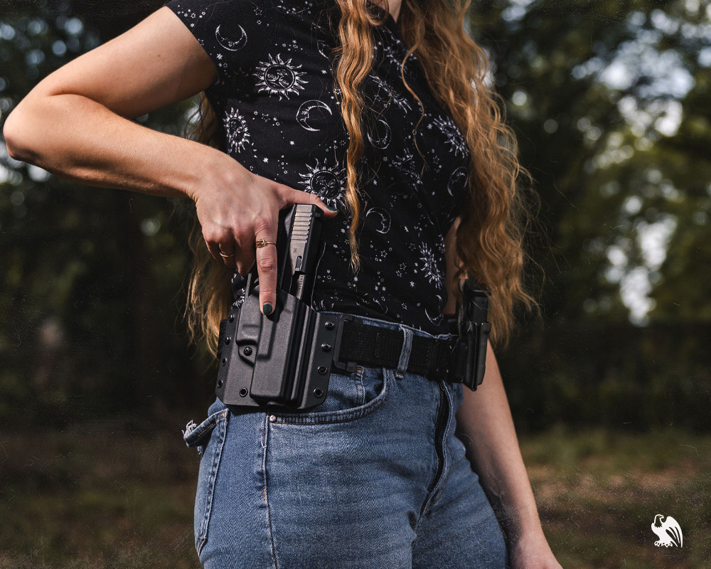 Woman carrying her handgun on a LightDraw OWB holster.  