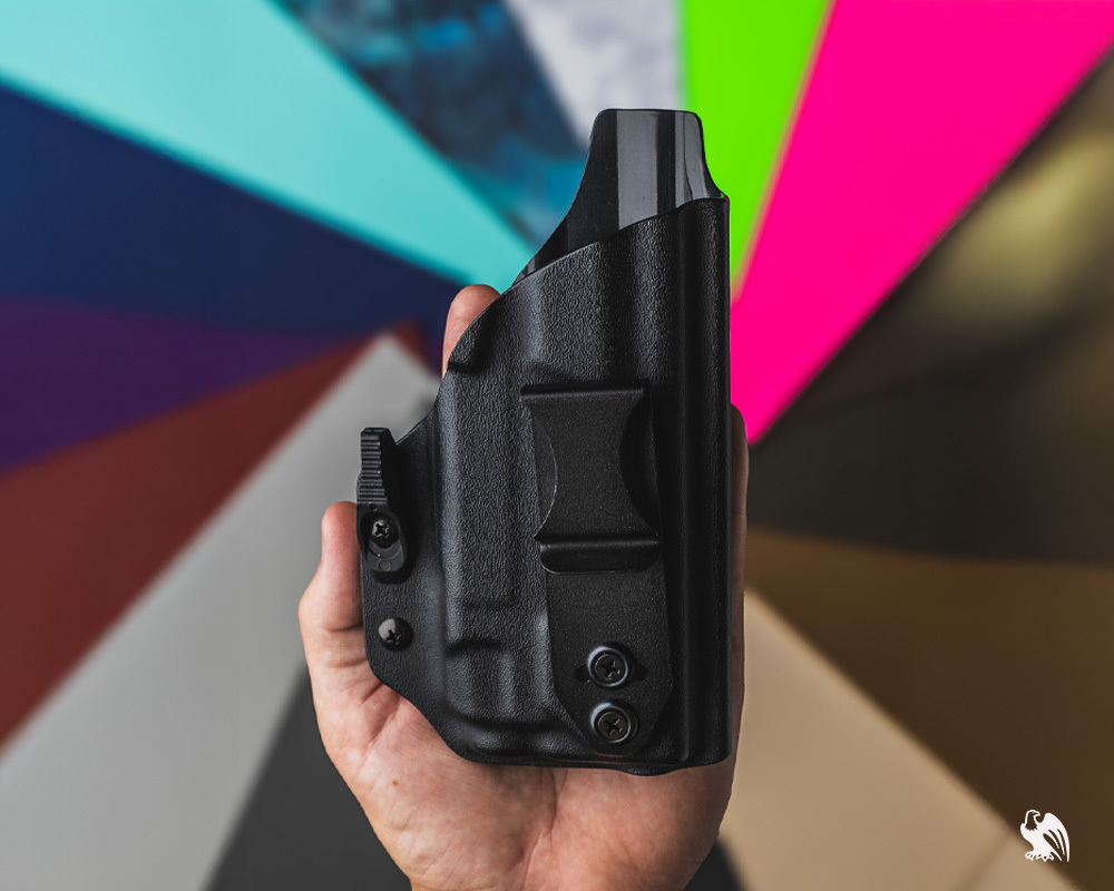Lighttuck IWB holster in black color with more kydex color options in the background. 
