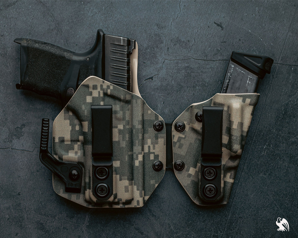 Top view of a SideTuck with a Ruger LCP handgun and its magazine. 