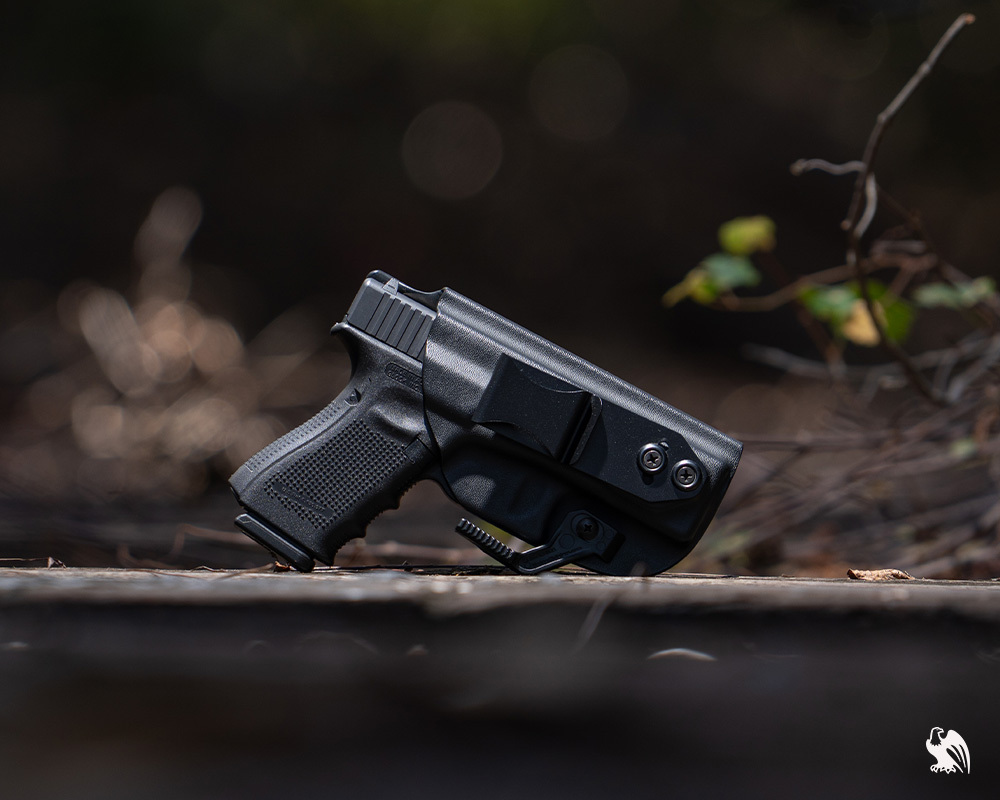 A handgun and a LightTuck IWB Kydex Photography