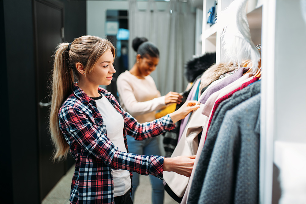 Women checking out clothes to buy from