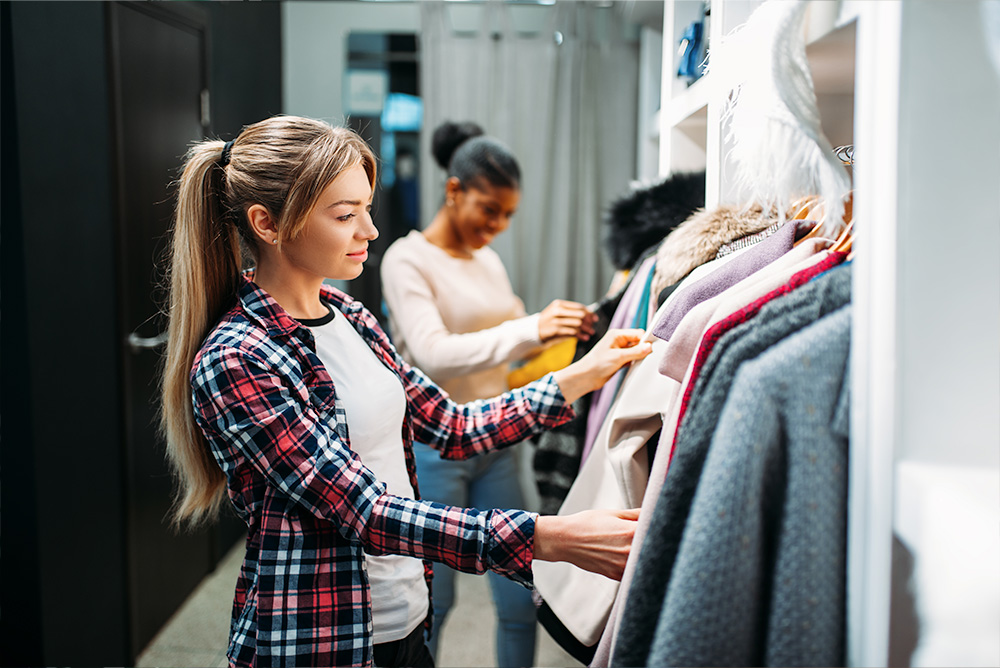 Women checking out clothes to buy from