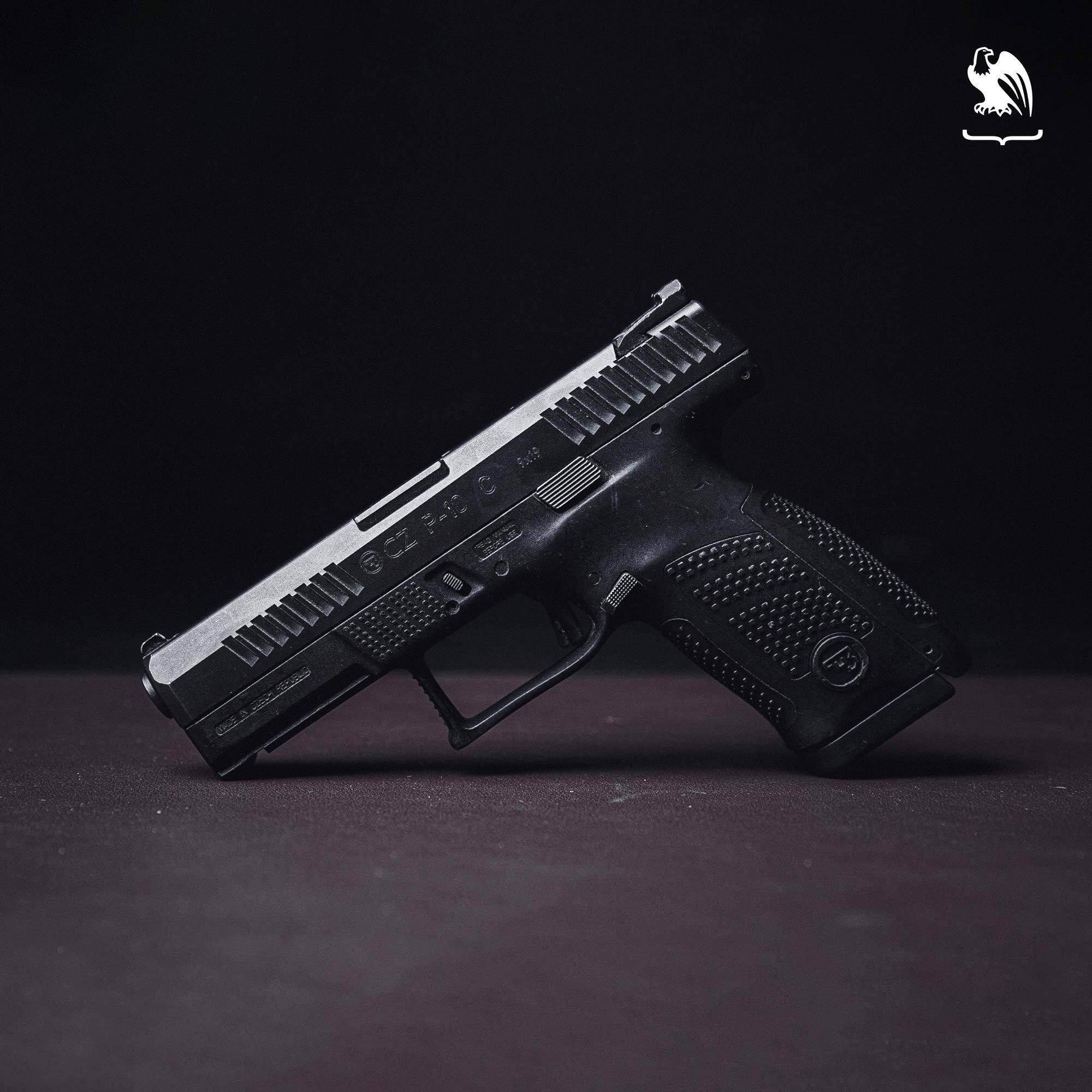 A side view of the CZ P-10 C against a black background