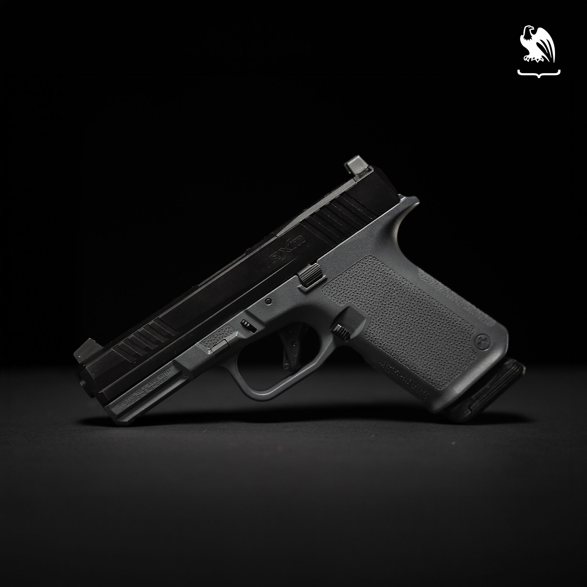A Ruger RXM pistol against a black background