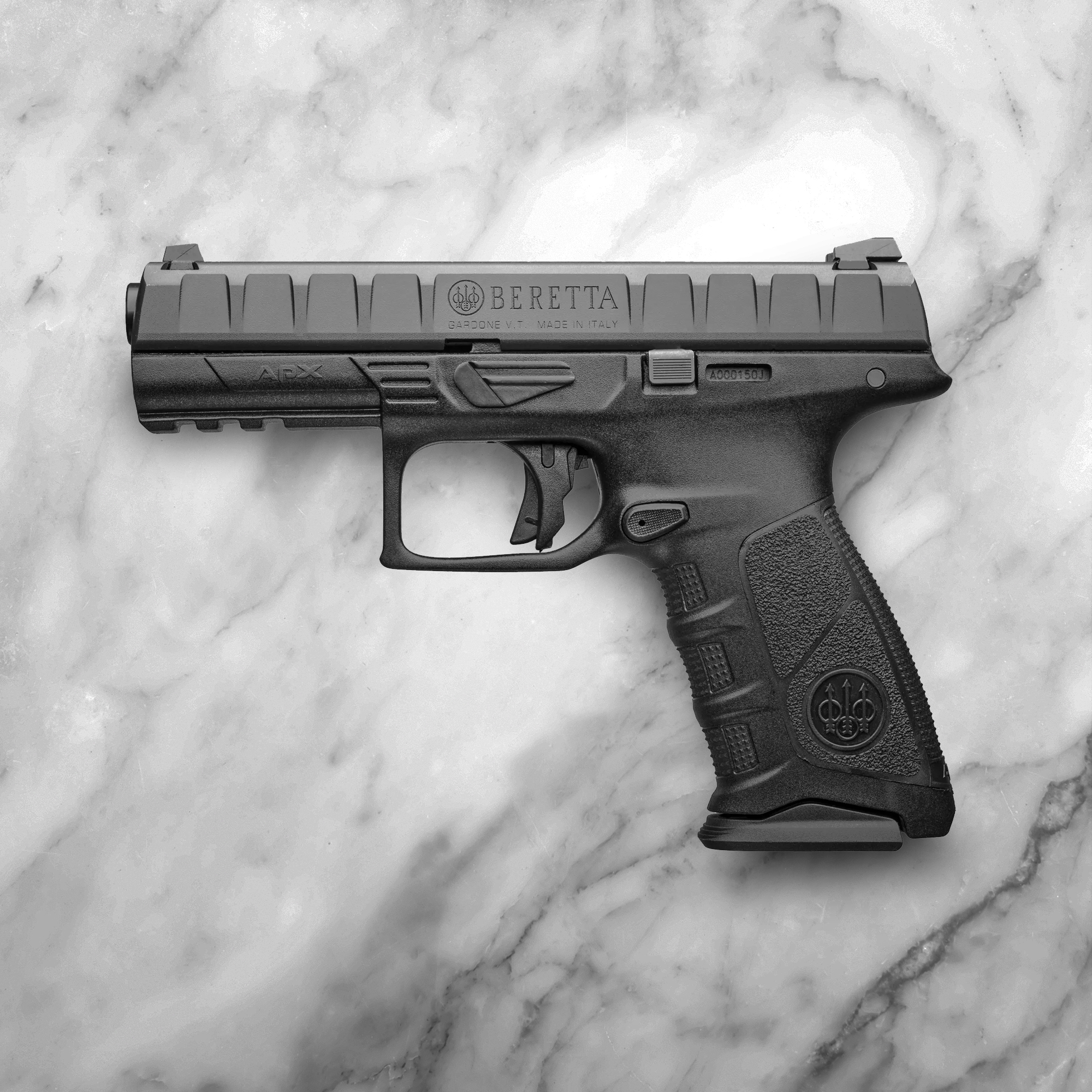 Beretta APX handgun laying on surface