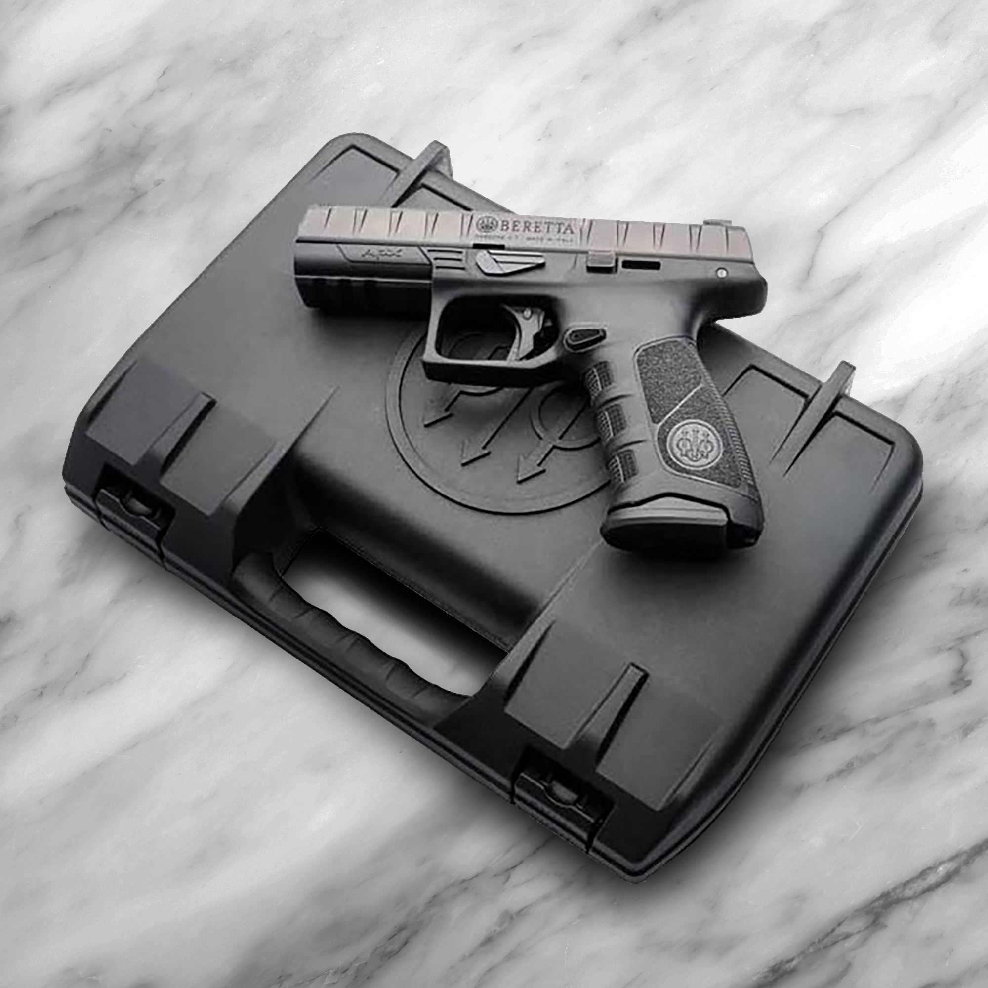 Beretta APX laying on top of case