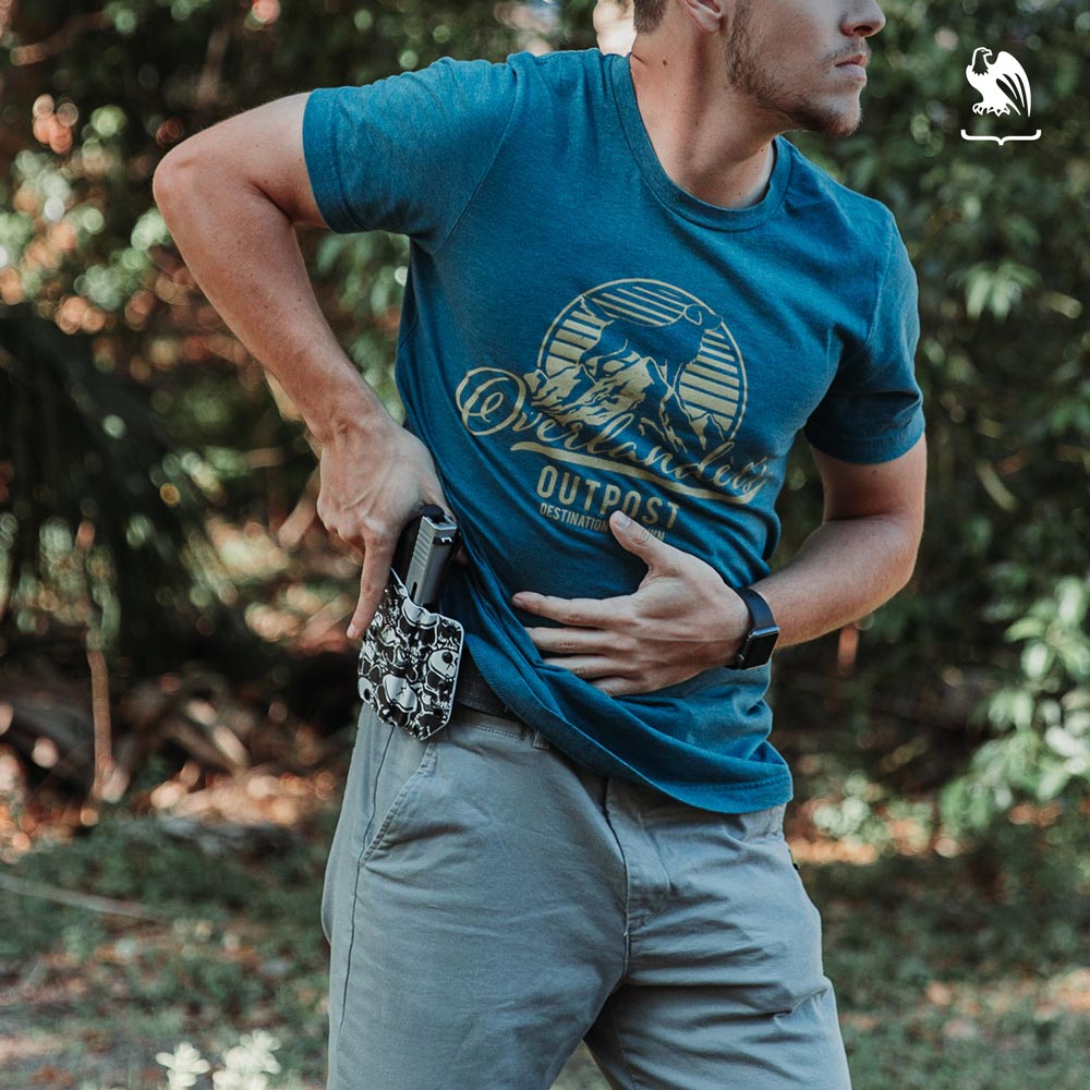 Can't fire weapon in a National Park - Generic Photography of a man about to draw his gun from a Kydex Holster from Vedder Holsters