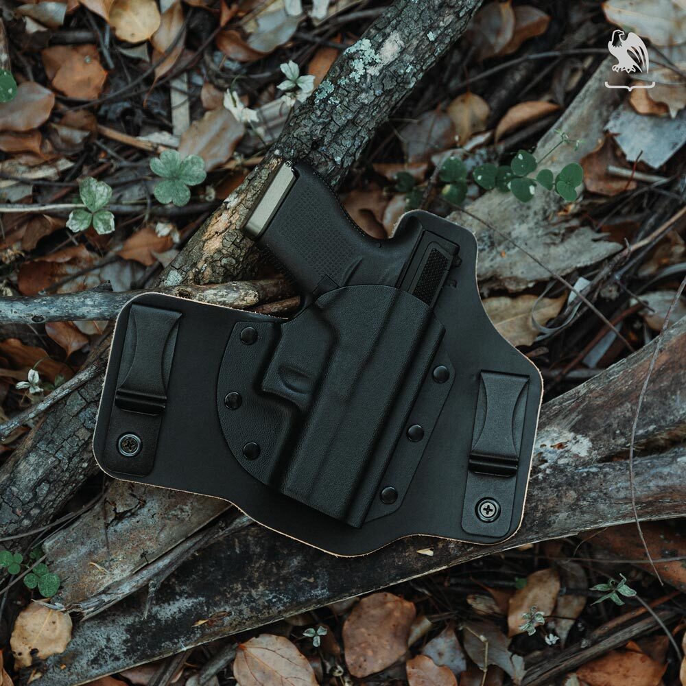 Kydex IWB concealed carry holster with handgun, hybrid leather design and dual belt clips for secure everyday carry.
