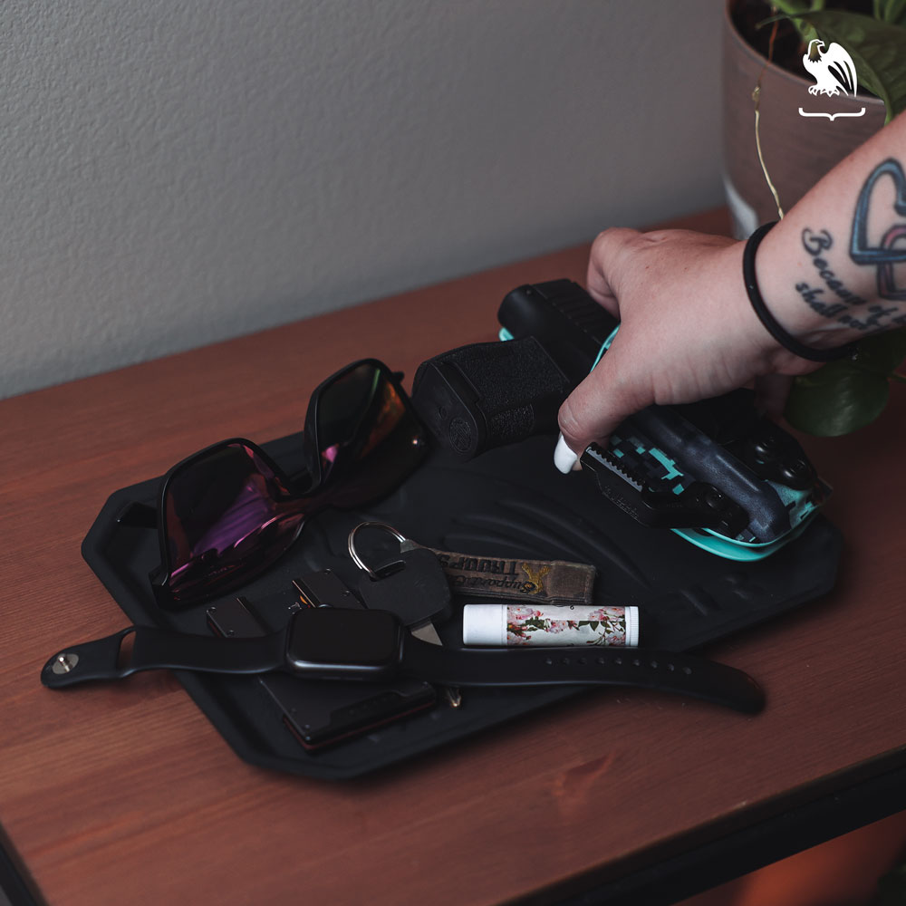 Choosing the right holster - EDC items laying on a Vedder Holsters EDC Tray