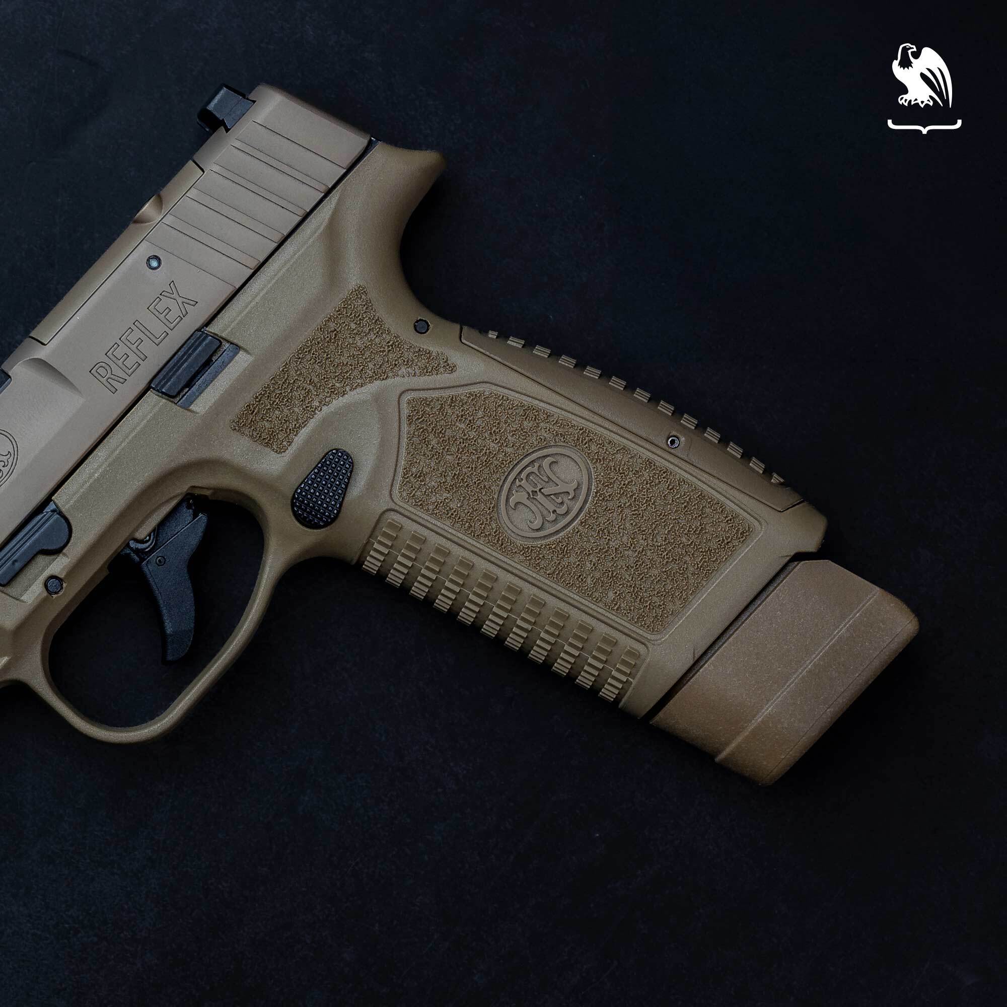 Close-up of an FN Reflex FDE pistol showing the ergonomic stippled handgrip and textured frame on a black background.