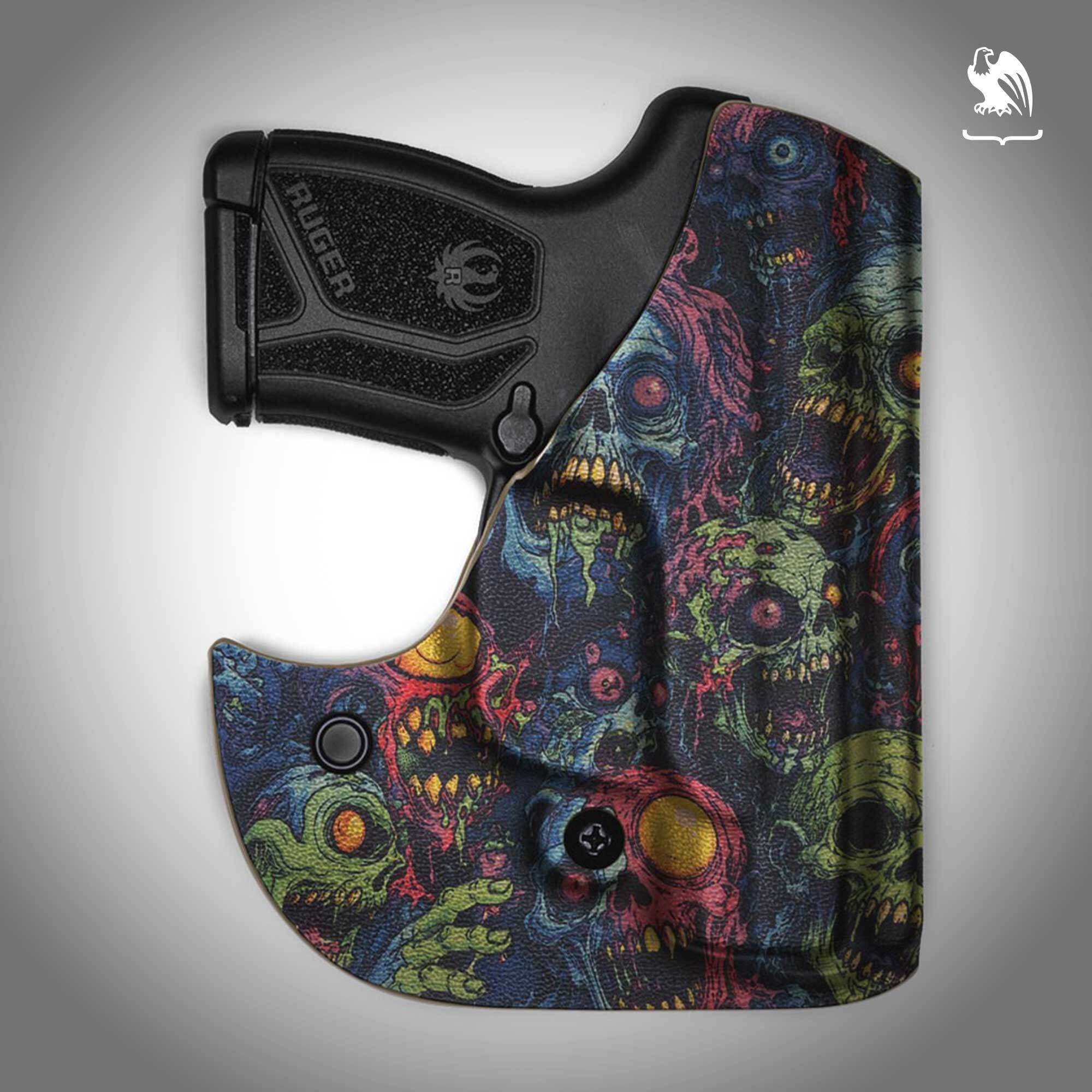 A Vedder Holsters Pocket Locker with a zombie pattern Kydex against a gray background