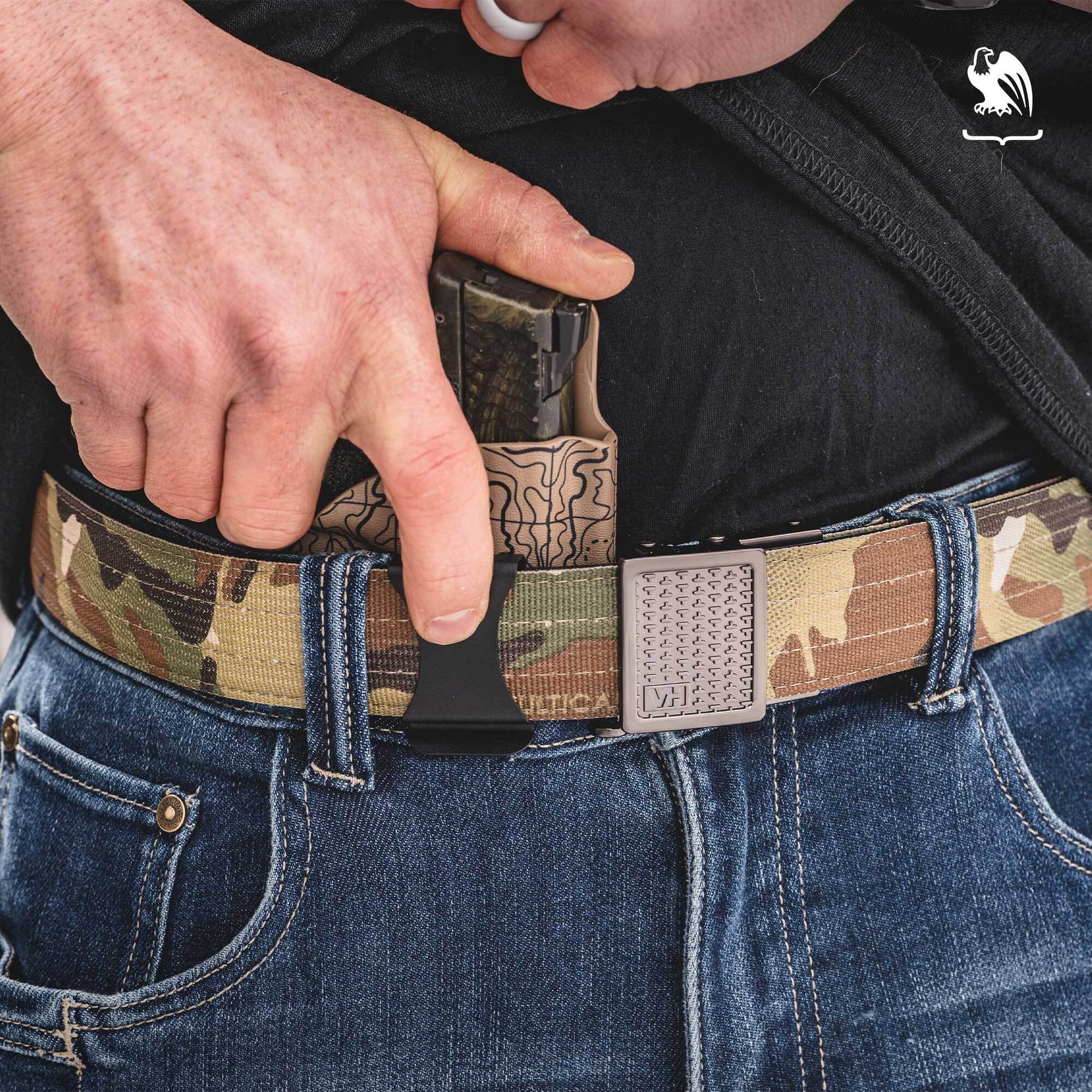 LightTuck and Kore Belt A man draws a pistol from a Vedder Holsters LightTuck carried inside the waistband