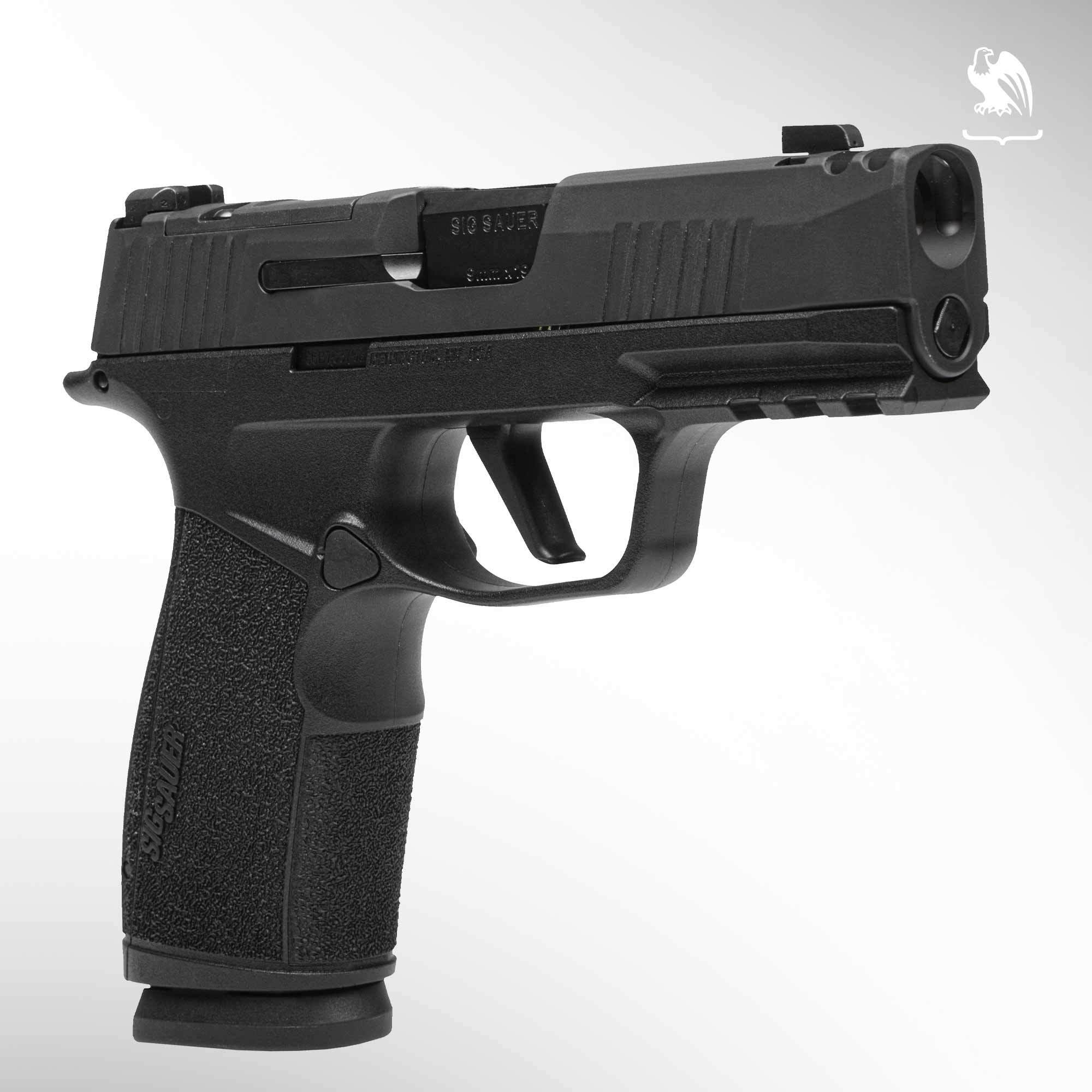 Sig Sauer P365 X-Macro with Foxtrot light on Picatinny rail resting on gray tactical bag