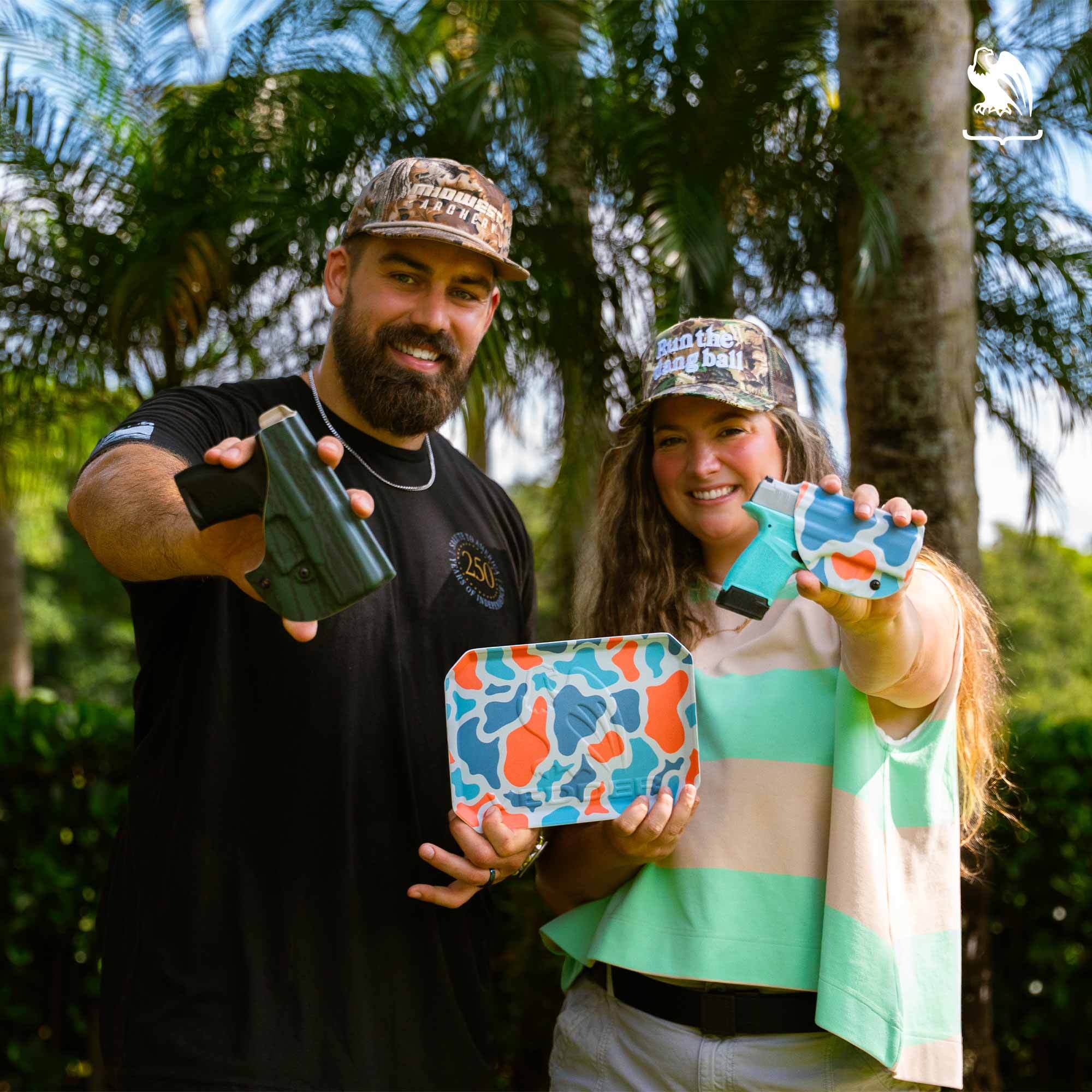 Zach and Hannah Sieler Zach and Hannah Sieler holding limited-edition Vedder Holsters Kydex patterns