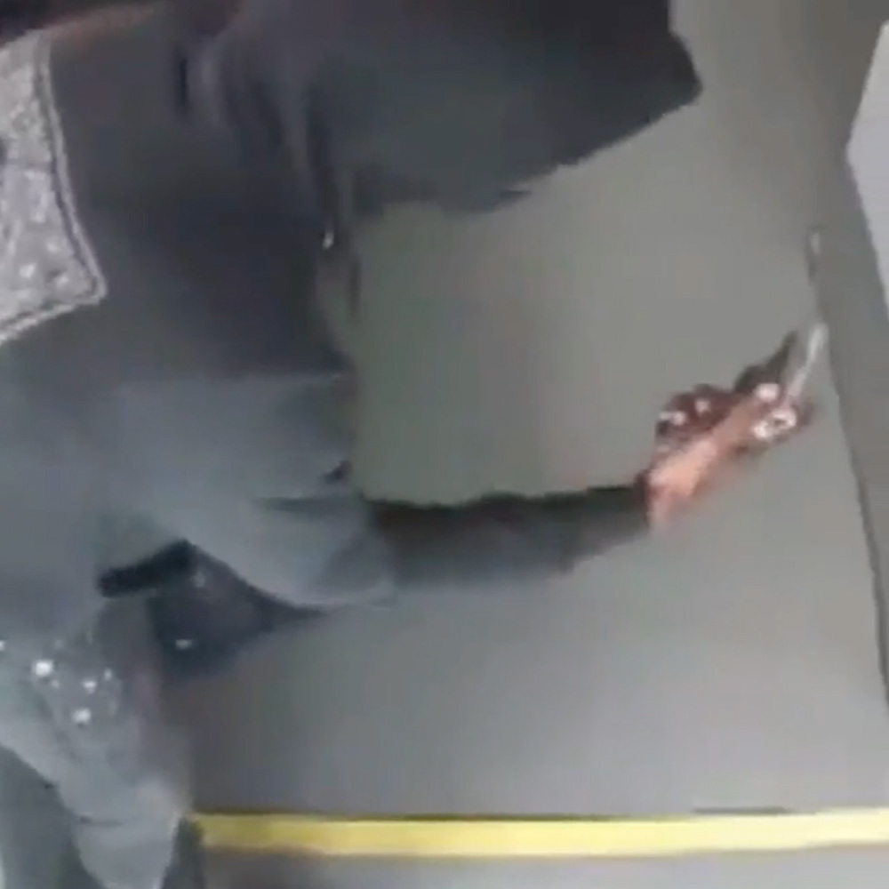 Incident Breakdown -  Person holding a handgun on his hand at the stairs of a bus