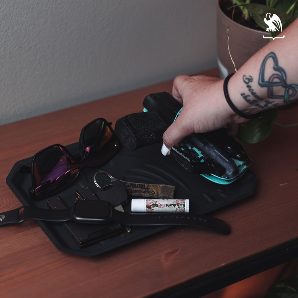 Display of an EDC Tray with edc items like glasses, watch, car keys, Geogrit Minimalist Wallet, your handgun on a LightTuck IWB Holster from Vedder Holsters - Generic Staged Photography
