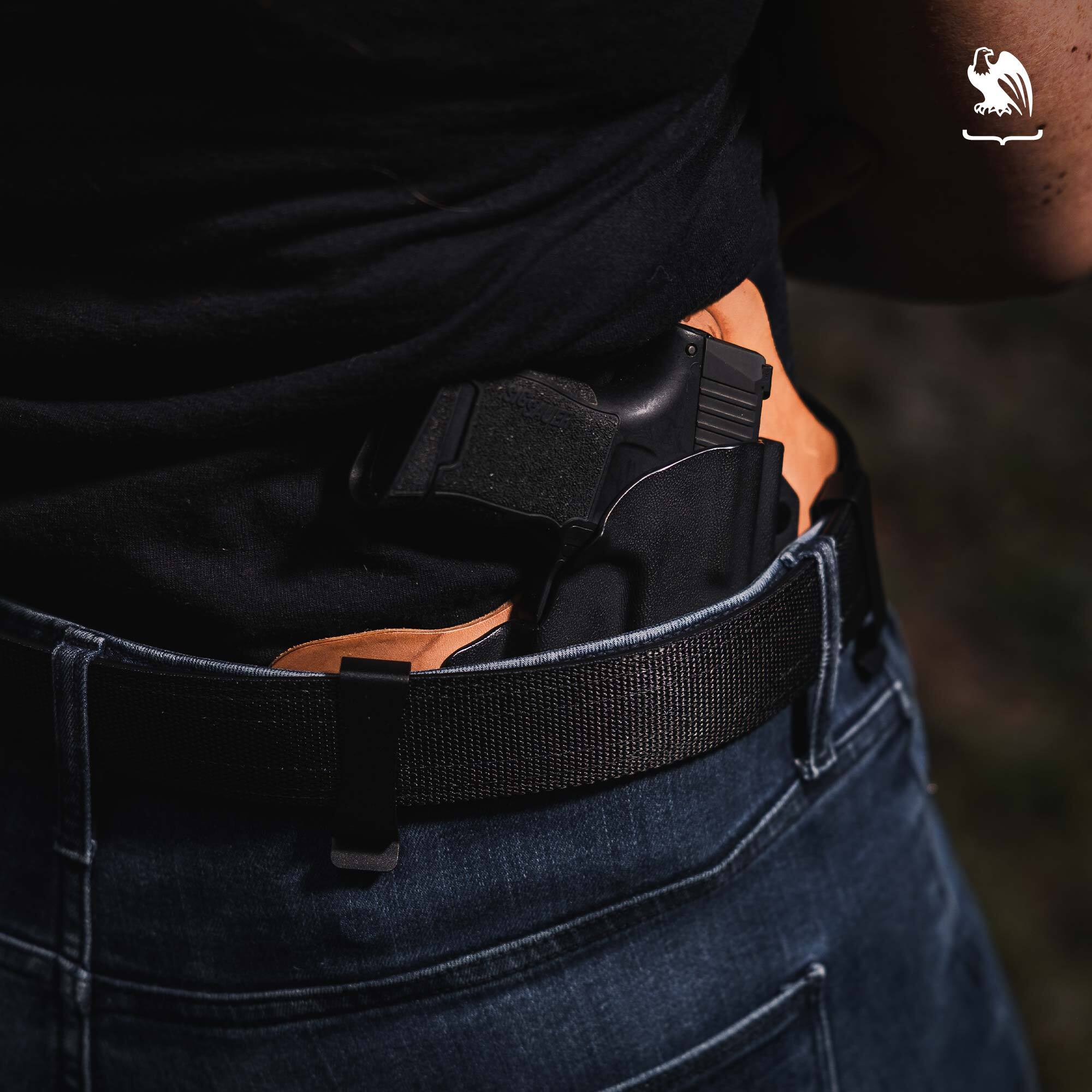 Person carrying a handgun on a IWB Hybrid Holster.