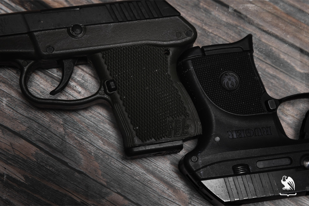 Close up of both Kel Tec P3AT and Ruger LCP handguns