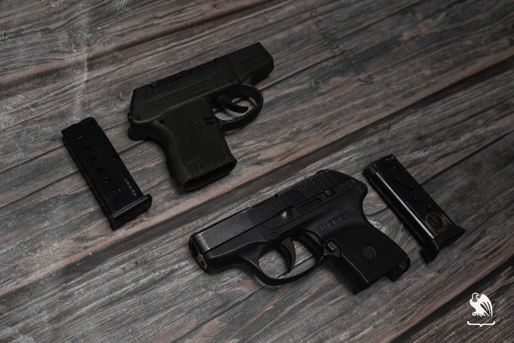 Both Kel Tea P3AT and Ruger LCP handguns and magazines photography
