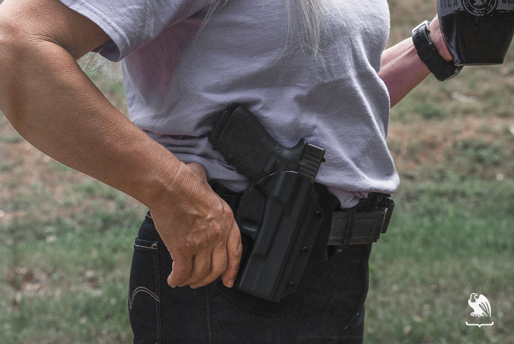Female wearing a LightDraw OWB gun Holster on her belt