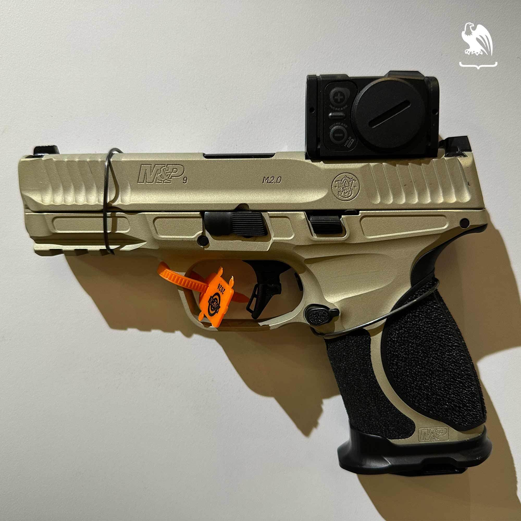 Smith & Wesson M&P9 M2.0 Metal Compact Spec Series VI with Aimpoint ACRO P-2 red dot and champagne Cerakote finish.