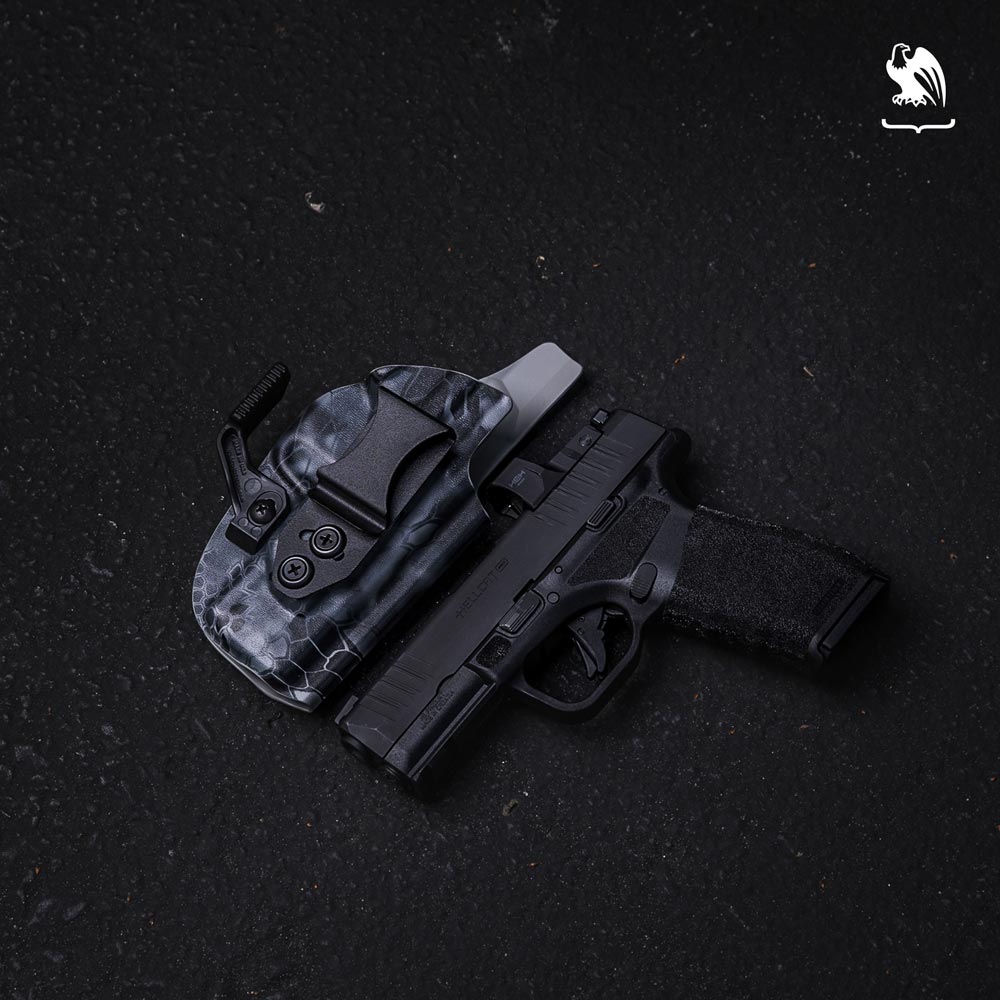 Vedder Holsters LightTuck IWB next to a Hellcat Handgun with a red dot sight - Product Photography
