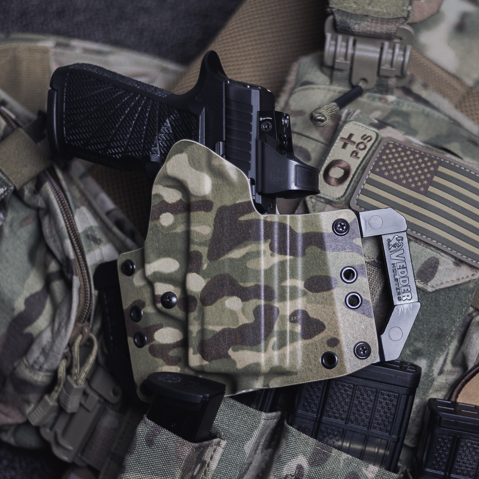 What is a red dot - Gun with red dot sight holstered on a Vedder Holster