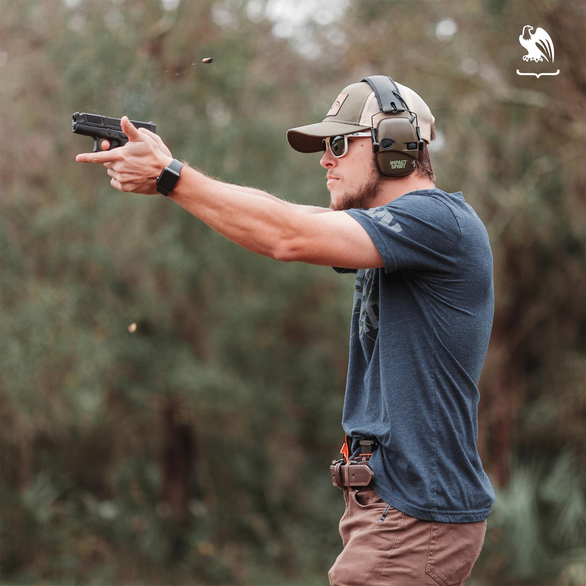 What to wear for the range - Man practice shooting at the gun range with essentials for safe and comfortable attire. 