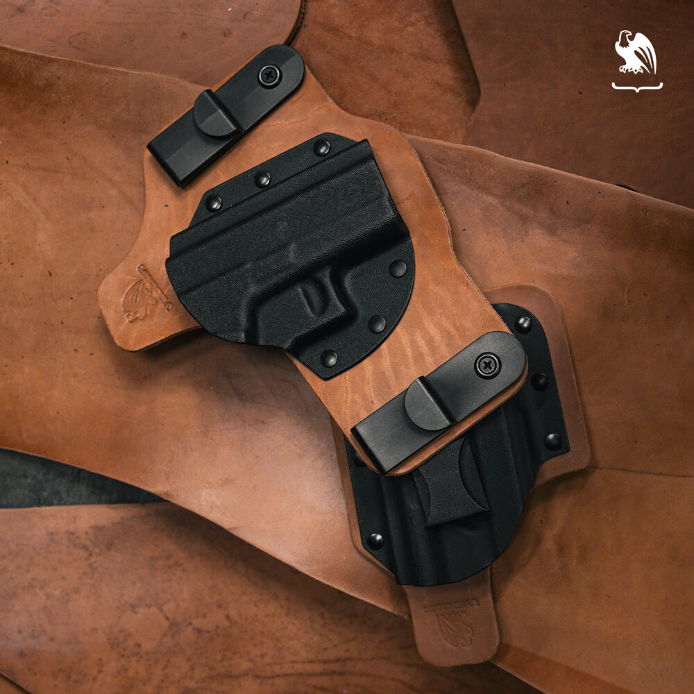 Two hybrid leather and Kydex IWB holsters displayed on Horween leather, handcrafted by Vedder Holsters for concealed carry.